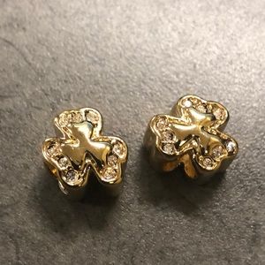 Two golden lucky diamond charms